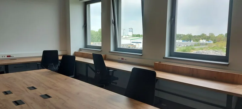 Long countertops under the windows provide space to work in natural light.