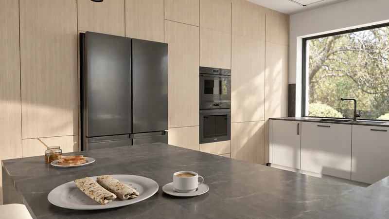 Light wooden furniture with space for kitchen appliances.