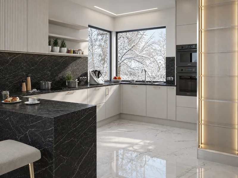 A dark peninsula with a stone pattern and corner glazing illuminating the kitchen.